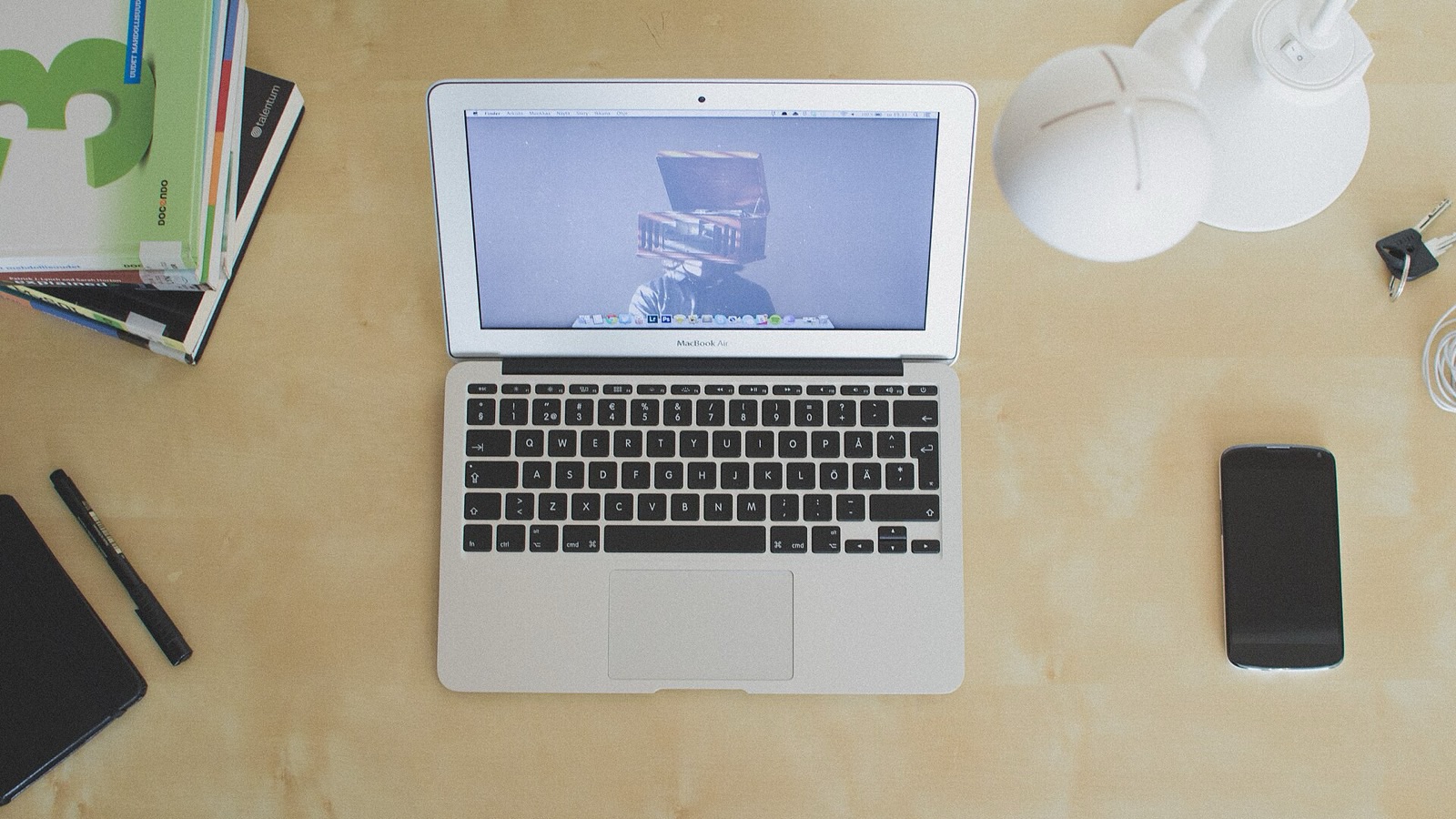 Open silver laptop on a clean desk ready for browser and desktop document work